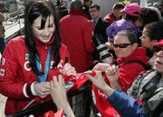 Mikkelson signing autographs for fans at Edmonton's Churchill Square in March 2010