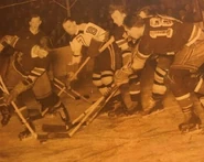 Bruin #7 Norm Calladine battles a group of Rangers including #18 Joe Shack, December 12, 1944.
