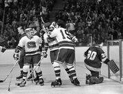 ,  and Dale Tallon celebrate the first goal in Canucks history, October 9, 1970.