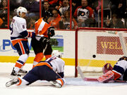 Daniel Brière (centre) watches a goal go in against the .