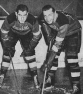 Milt Schmidt and Woody Dumart in the gold jersey introduced in 1940.