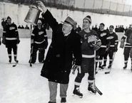 1954 Prison game trophy.jpg (1.83 MB) Jack Adams presents the trophy, Marquette Prison game, February 2, 1954.