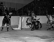 Jack Gelineau and Milt Schmidt defend in Game 2 of the 1951 Semi-finals, March 31, 1951.