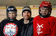Richardson kneels with his daughters  (left) and Morgan (right), at the Bell Capital Cup in 2004.