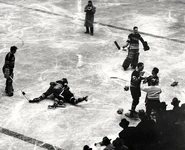 Goalies Sam LoPresti and Dave Kerr watch several fights, January 1941.