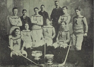 Brannen, sitting at far right above the , with the  in 1899.