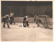 12Dec1937-Robertson Johnson.gif (160 KB) Earl Robertson clears the puck while Ching Johnson guards the net against the Canadiens, December 12, 1937.