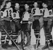 Eddie Shore returns to practice and is greeted by Flash Hollett, Tiny Thompson, Dit Clapper and Jack Portland, November 18, 1938.