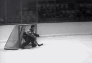 Tiny Thompson stops Baldy Cotton during the Bruins-Leafs 1-1 tie, November 10, 1932.