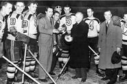 12Apr1941-Bruins receive Cup from Calder.jpg (94 KB) Bruins President Weston Adams and coach Cooney Weiland receive the Cup from Frank Calder, April 12, 1941.