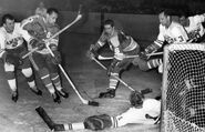 Willie O'Ree scores on Gilles Villemure during the 1965-66 Western Hockey League season.