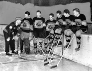 Clem Loughlin, Mike Karakas, Ernest Klingbeil, Bun LaPrairie, Milton Brink, Al Suomi and Paul Schaefer before the last game of the season, March 21, 1937.