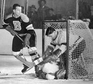 Milt Schmidt, Terry Sawchuk, Marcel Pronovost during Game 1 of the 1953 Semi-finals, March 24, 1953.