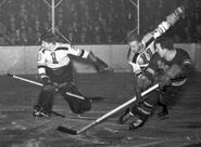 Frank Brimsek, Robert "Red" Hamill, Alex Shibicky in 1940-41 action.