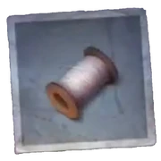 A Coil of Thread - It seems to have been put away carefully, the thread rewound on the coil.