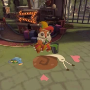 A large squirrel, identical to the one present at the Squirrel Stage, painting on the ground in front of the Event Area