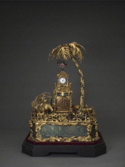 The gilt bronze clock with a country scene and water automaton that this costume is based on.