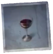A Glass Of Red Wine - The red wine found on the Rainmaker's table. Not a drop has been drunk.