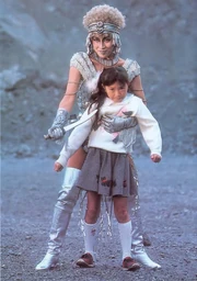 An image of Galactic Witch Gilza capturing a child and holding her hostage.