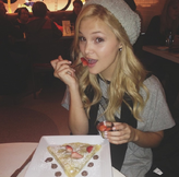 Olivia Holt with Strawberries