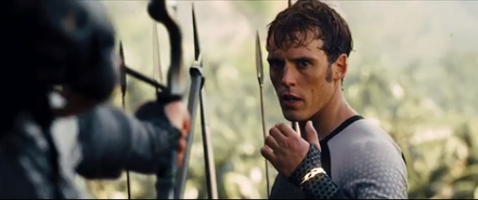 Katniss aiming her arrow at Finnick