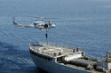 The fleet support oiler ship Robert E. Lee III (1982- 2012) and it's Lynx helicopter in action of the coast of Puntland in 2009.