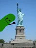 Pickle salutes in front of The Statue Of Liberty.