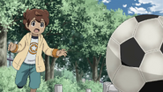 Tenma playing soccer as child.