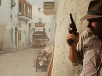 Indiana Jones approaches a truck outside The Golden Key Insurance Co.