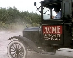 An Acme Dynamite Company vehicle on a  country road in February .