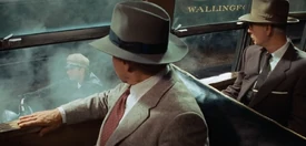  and another passenger look out the window of  at  and the Wallingford in .