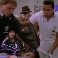 Paramedic #2 (left) with Dr. Jeffers (right) as Indiana Jones (center) looks on.