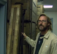 Property master Doug Harlocker with the Staff of Moses and its crate.