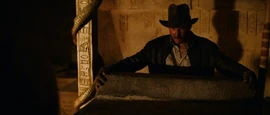 Indiana Jones opens the stone sarcophagus containing the Ark.