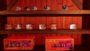 A shelf with Rambley figurines and Rambley's Railroad model trains.