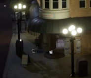 The entrance of Café de Raton Laveur, with the cat outside.