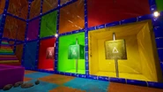 The player walking towards the colored cubes.