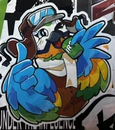 Mollie on a sticker drinking Bird Up.