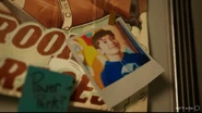 A photo of main protagonist Ed as a child, with a sticky note nearby asking, "Power in Park?"