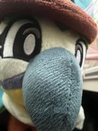 A teaser of a photo of the mollie macaw plushie