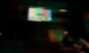 Another blurred image of Mollie's Play Area, showing an early version of the ball pit and a large TV that was removed in the finished game.