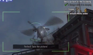 Cole taking a picture of the Helicopter with his Camera.