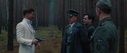 Aldo Raine shoot Herrman with Landa's Walther P38 in the woods