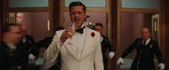 Aldo Raine about to drink from his glass