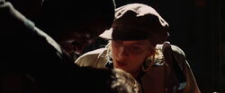 Shosanna threatens Gaspar with an axe.jpg