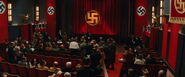 The cinema auditorium, decorated with swastikas.