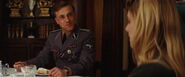 Hans Landa looks at Shosanna eating