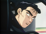 At the gas station telling Itsuki to bring Takumi for his race