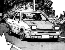Anime image of initial d , takumi fujiwara is the pilot , toyota ae86 is  the car while drift a curve and tokyo is the background in the night