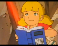 Penny using the laser from her computer book to destroy an ancient weapon